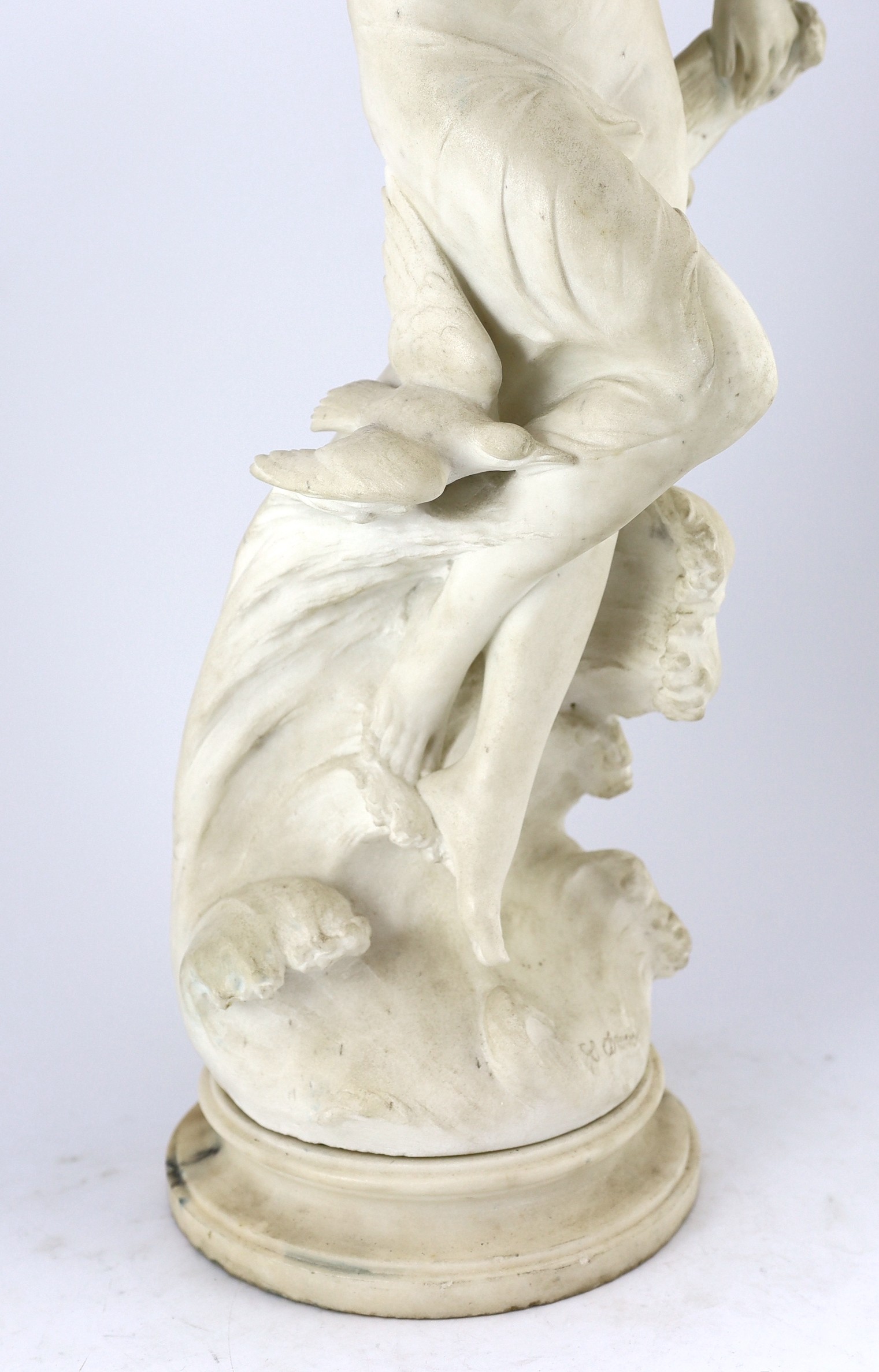 An early 20th century Continental carved white marble figure of a sea nymph riding the waves 79cm high